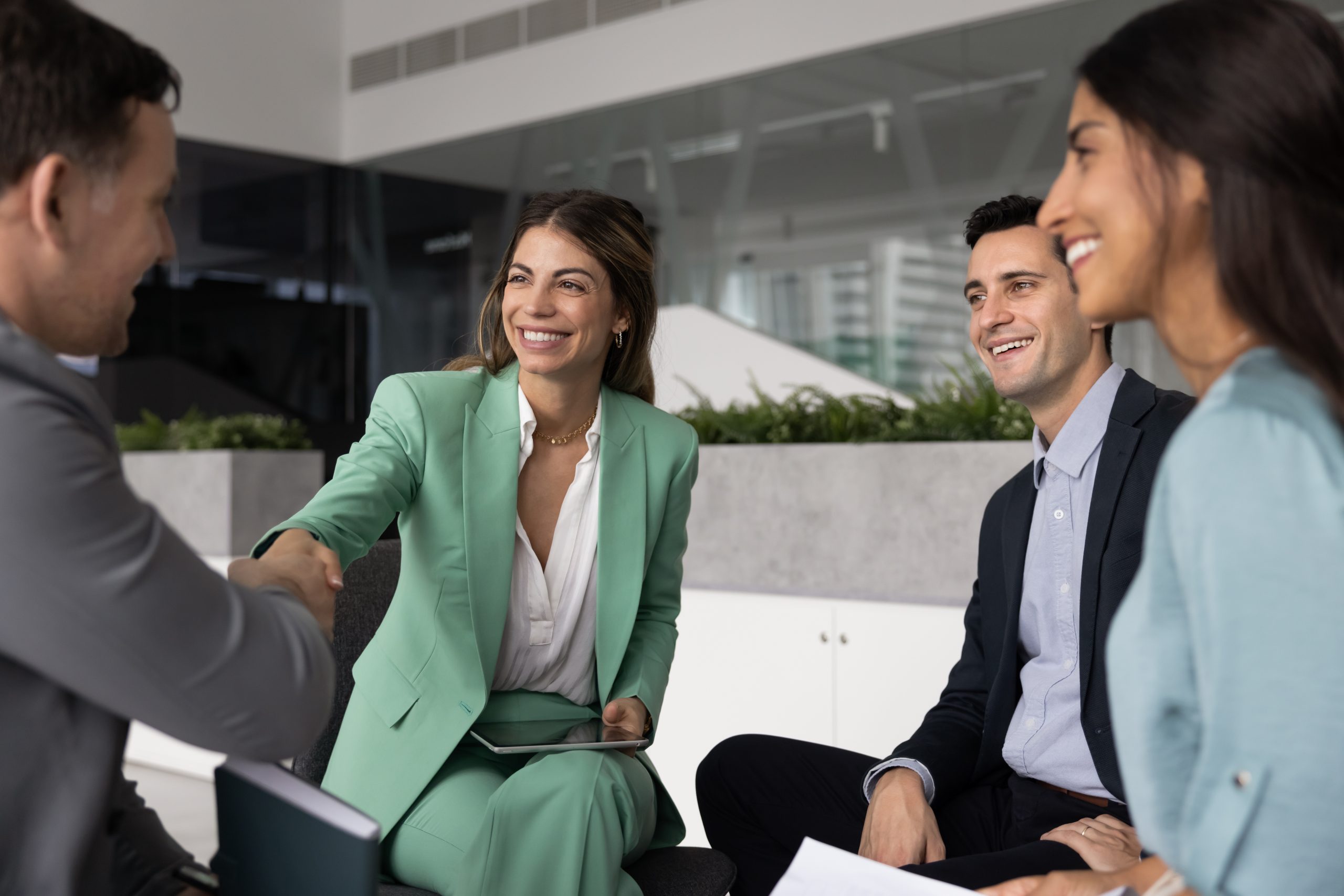 Businesswoman handshake with team leader on group discussion in office